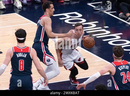 Washington, USA. 31st Mar, 2024. WASHINGTON, DC - MARCH 31: Washington Wizards guard Johnny Davis (1) moves in on Miami Heat forward Nikola Jovic (5) during a NBA game between the Washington Wizards and the Miami Heat, on March 31, 2024, at Capital One Arena, in Washington, DC. (Photo by Tony Quinn/SipaUSA) Credit: Sipa USA/Alamy Live News Stock Photo