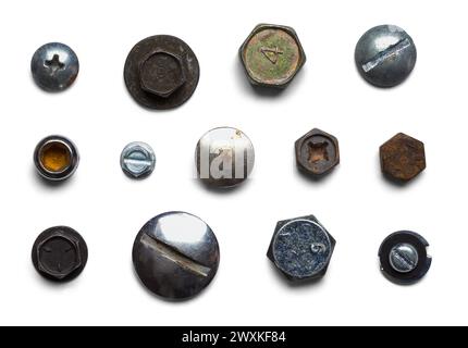 Old Bolts and Screws Heads Cut Out on White. Stock Photo