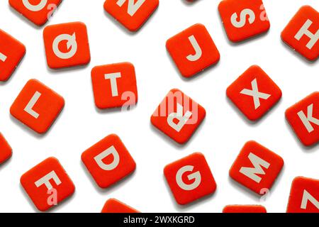 Red Wood Letter Tiles Cut Out on White. Stock Photo