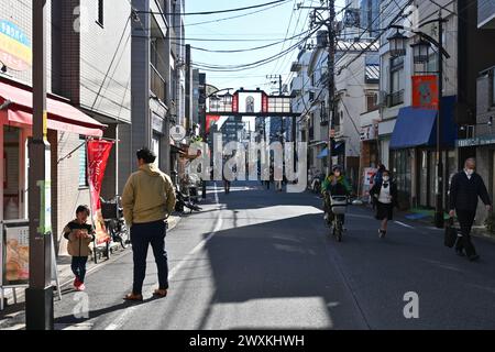 People enjoying a sunny day in Yanaka Ginza – Taito City, Tokyo, Japan – 28 February 2024 Stock Photo