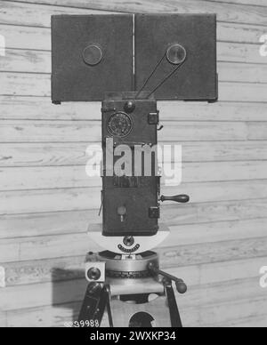 An image of a Pathe motion picture camera, viewed from the rear. This ...