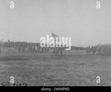 Colors in review, generals and staff in the background; near Le Mans, Sarthe, France ca. 1919 Stock Photo