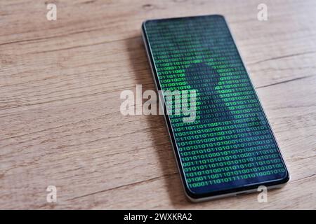 Smartphone with glowing binary code and keyhole on the screen. Copy space for text. Cyber security concept. Stock Photo
