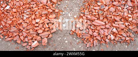 Shards of roof tiles for patching holes in the carriageway Stock Photo