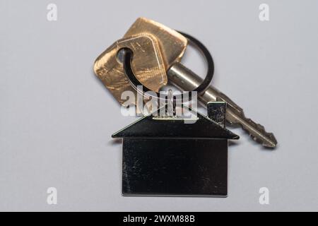 A close-up of keys on a plain background. Stock Photo