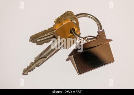 A close-up of keys on a plain background. Stock Photo