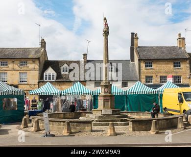 The war memorial seen on Market day in Moreton in Marsh, Gloucestershire, England, UK Stock Photo