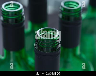 A close-up shot of the tops of open wine bottles Stock Photo