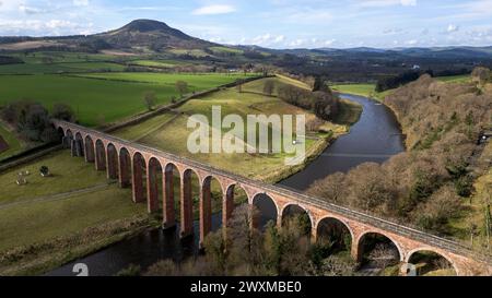 Aerial view of the Leaderfooot Viaduct where it crosses the River Tweed near Melrose. The site of Trimontium Roman Fort lies to the south of the river Stock Photo