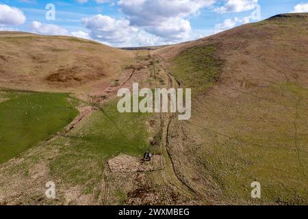 Aerial drone view of the route of Dere Street Roman road looking south towards Woden Law, Towford, Jedburgh, Scotland. Stock Photo