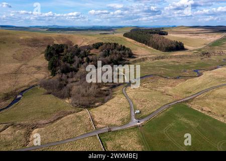 Aerial drone view of Towford south of Jedburgh in the Cheviot Hills. Dere street Roman road passes through this valley. Stock Photo