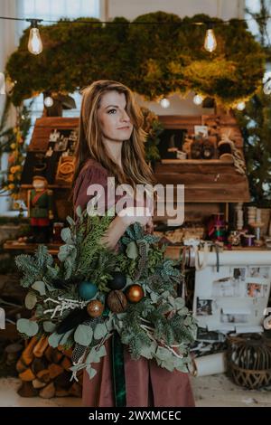 Woman holding a Christmas wreath Stock Photo