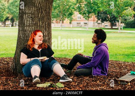 Multicultural students talking on campus at University of Montana Stock Photo