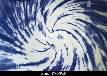 Artistic gradient blue on white vortex pattern of ceramic plate Stock Photo
