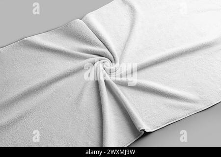 Mockup of a white terry towel, folded with wrinkles, on the background, a large bath cloth for advertising. Template of soft clothes after a shower, b Stock Photo