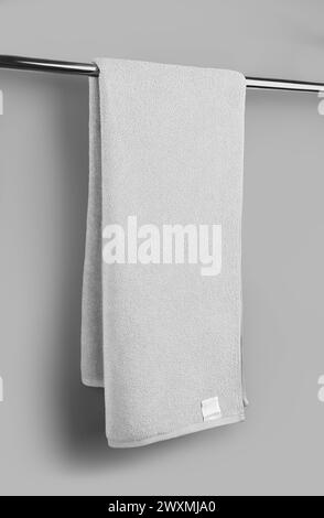 Template of white terry towel on towelling, shaggy fabric with label for advertising, branding, isolated on background with shadows. Mockup of fashion Stock Photo