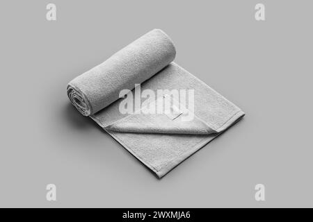Mockup of a white terry towel, twisted and folded with a label for advertising, isolated on background. Template of soft clothes after shower, spa. Do Stock Photo