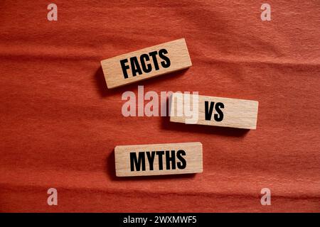 Facts vs myths words written on wooden blocks with brown background. Conceptual symbol. Copy space. Stock Photo