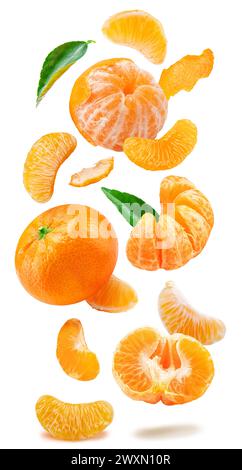 Levitating ripe mandarin fruits, leaves and mandarin slices on white background. File contains clipping paths. Stock Photo