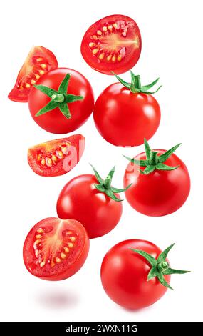 Falling cherry tomatoes and tomato slices isolated on white background. Macro shot. File contains clipping paths for each item. Stock Photo