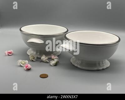 Two white plates with a black rim stacked on top of each otherv Stock Photo