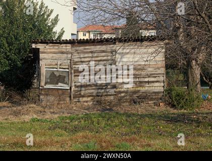 old suburban wooden garden shed in backyard, Italy Stock Photo
