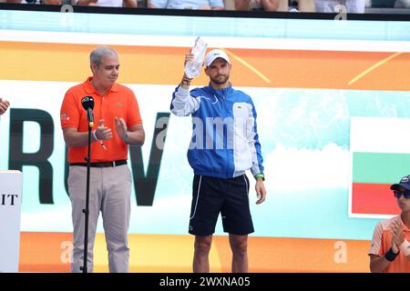 MIAMI GARDENS, FLORIDA - MARCH 31: Grigor Dimitrov from Bulgaria poses with the Miami Open men's trophy at Hard Rock Stadium on March 31, 2024 in Miami Gardens, Florida. Credit hoo-me.com/MediaPunch Stock Photo