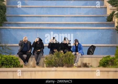 Tehran, Tehran, Iran. 1st Apr, 2024. Shiite worshipers place copies of the Quran on their heads during the holy Islamic month of Ramadan, in Tehran, Iran, Sunday, April 01, 2024. (Credit Image: © Sobhan Farajvan/Pacific Press via ZUMA Press Wire) EDITORIAL USAGE ONLY! Not for Commercial USAGE! Stock Photo