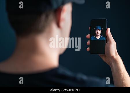 Deep fake and face recognition. Deepfake or identity scan with phone. Facial id verification with cellphone. Identification technology in smartphone. Stock Photo