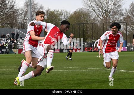 AMSTERDAM - Jinairo Johnson of Ajax U17 (m) celebrates his goal during the final Ajax Future Cup 2024 match between Ajax o17 and FK Partizan o17 at De Toekomst sports complex on April 1, 2024 in Amsterdam, Netherlands. ANP | Hollandse Hoogte | GERRIT VAN COLOGNE Stock Photo