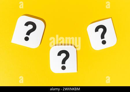 Group of Question marks signs on yellow background Stock Photo