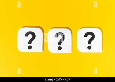 Group of Question marks signs on yellow background Stock Photo