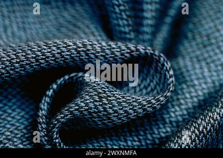 A close-up shot of dark blue fabric with black threads Stock Photo