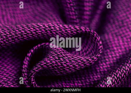 A wool fabric texture in purple with a dark pattern Stock Photo