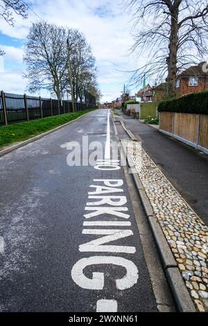 Leatherhead Surrey, UK, April 01 2024, No Parking Sign Painted On The Road In Residential Area With Nobody Stock Photo