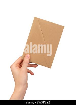 Brown kraft paper envelope in hand isolated on white background. Stock Photo