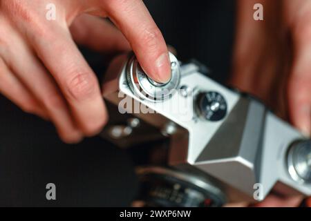 A close-up view of a persons hands holding a camera, ready to take a picture. Stock Photo