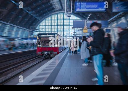 Train station on Alexanderplatz in Berlin during morning rush hour. A lot of people waiting for the typical trains to pick them up and take them to wo Stock Photo