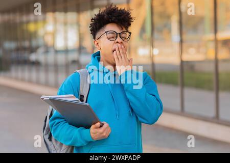 Young student with books at university campus Stock Photo