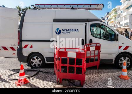 A Visabeira Global van is stationed on a telecommunications installation in Quarteira, Portugal. Stock Photo