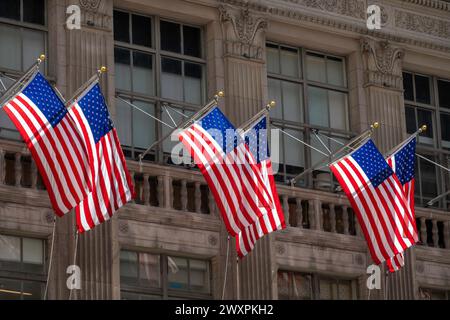 Backlit American flags on the flagship Saks, fifth Avenue store, 2024, New York City, USA Stock Photo