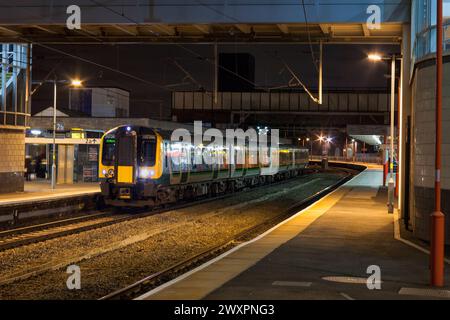 London Midland Siemens Desiro class 350 electric multiple unit train 350246 at Wolverhampton railway station on the west coast mainline at night Stock Photo