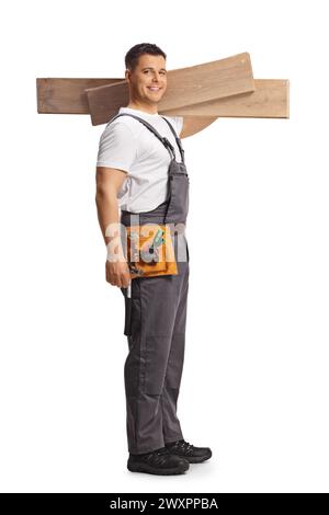 Full length shot of a carpenter holding wooden beams isolated on white background Stock Photo