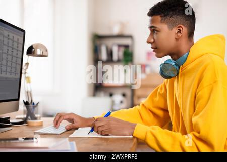 Young person working on desktop computer Stock Photo