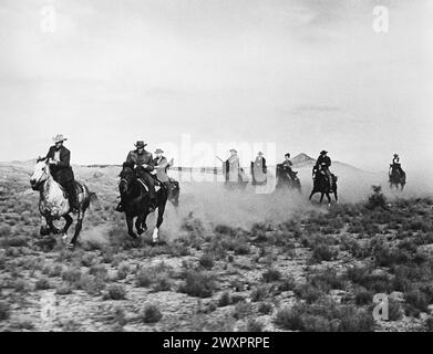 Audie Murphy, George Tobias, Ruta Lee, Edward Platt, Alan Hale, Jr., on-set of the film, 'Bullet For A Badman', Universal Pictures, 1964 Stock Photo