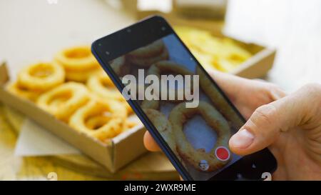 Taking photo of food with smartphone , mobile photographer  Stock Photo