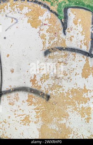 Abstract detailed wall texture with green white graffiti paint. Stock Photo