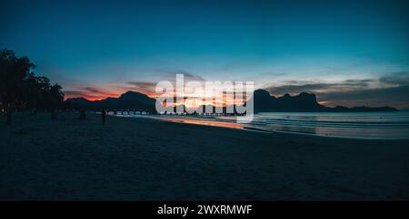 A stunning sunset over El Nido's shoreline in the Philippines Stock Photo