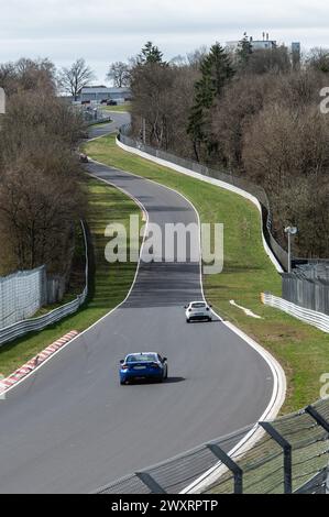 SYMBOL - 31 March 2024, Rhineland-Palatinate, Nrburg: Cars Drive On