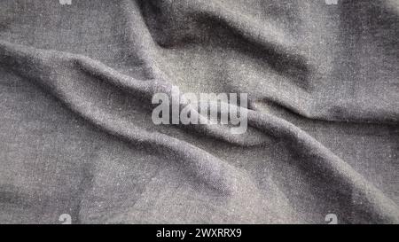 Abstract background texture of natural light color fabric. Fabric texture of natural cotton or linen, silk or satin, wool or jersey textile material. Stock Photo